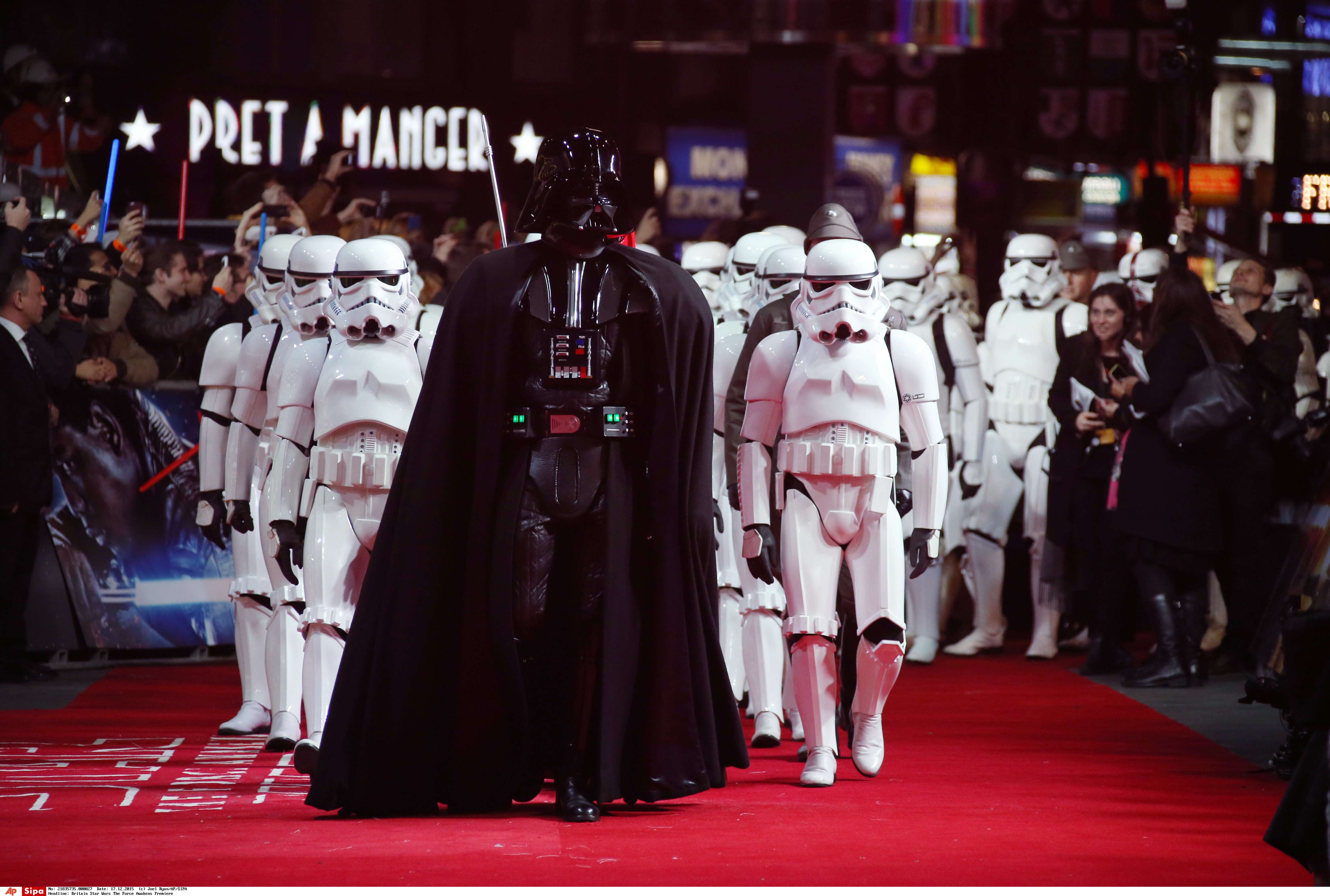 Actors dressed as Stormtroopers and Darth Vader arrive at the European premiere of the film 'Star Wars: The Force Awakens ' in London, Wednesday, Dec. 16, 2015. (Photo by Joel Ryan/Invision/AP)/LENT101/890882132897/21615113675, 21334631/1512170406